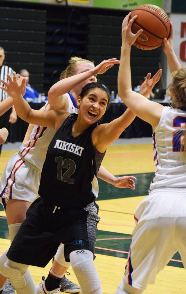Nikiski&rsquo;s Brianna Vollertsen fights for the rebound against Sitka in Friday&rsquo;s Class 3A state semifinal at the Alaska Airlines Center in Anchorage. (Photo by Joey Klecka/Peninsula Clarion)
