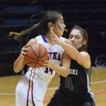 Nikiski&rsquo;s Emma Wik (right) tries to force a turnover on Sitka&rsquo;s Marlis Boord in Friday&rsquo;s Class 3A state semifinal at the Alaska Airlines Center in Anchorage. (Photo by Joey Klecka/Peninsula Clarion)