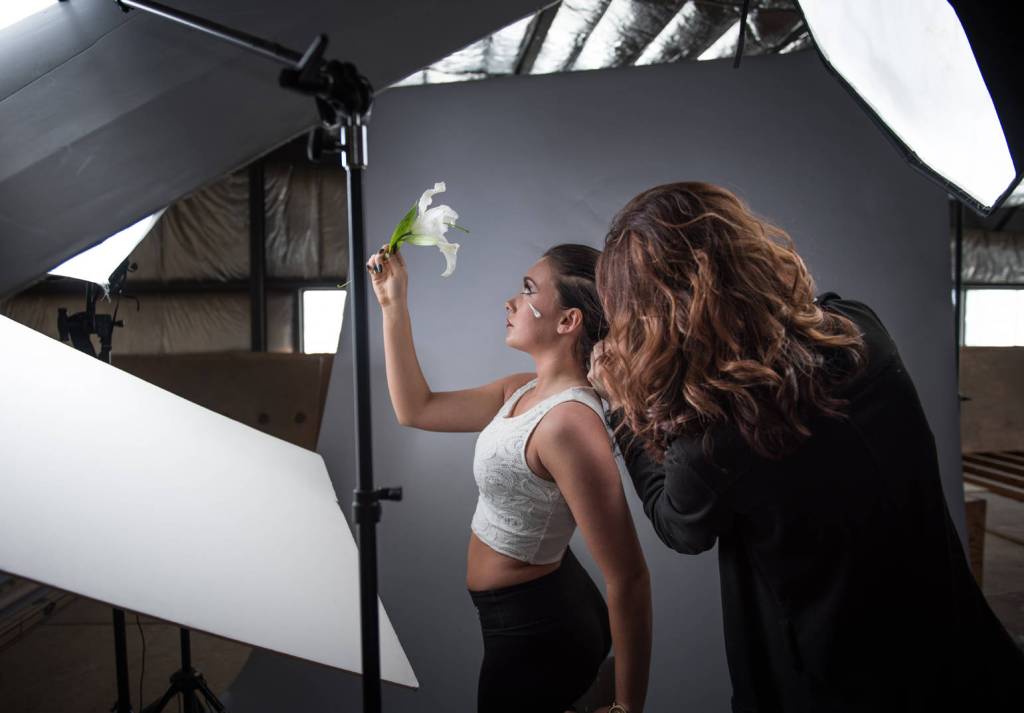 Jasmin helps create the Artistic Puppy shot for Job Shadow Olivia Daniels.