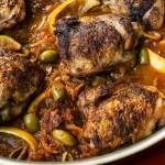 This February 2017 photo shows braised chicken with green olives and onions in New York. This dish is from a recipe by Katie Workman. (Sarah Crowder via AP)