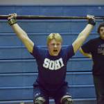 Soldotna freshman Galen Brantley III cleans and jerks Wednesday evening at the 11th biannual CrossFit Competition at Soldotna High School. (Photo by Joey Klecka/Peninsula Clarion)