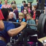 A crowd of onlookers watch as Soldotna freshman Ateliano Faletoi-Eli attempts a squat lift Wednesday evening at the 11th biannual CrossFit Competition at Soldotna High School. (Photo by Joey Klecka/Peninsula Clarion)