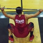 Kenai Central senior Jonathan Delgado attempts a lift Wednesday evening at the 11th biannual CrossFit Competition at Soldotna High School. (Photo by Joey Klecka/Peninsula Clarion)