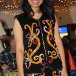 Afina from Indonesia wears traditional costume from her country as she serves dinner guests.