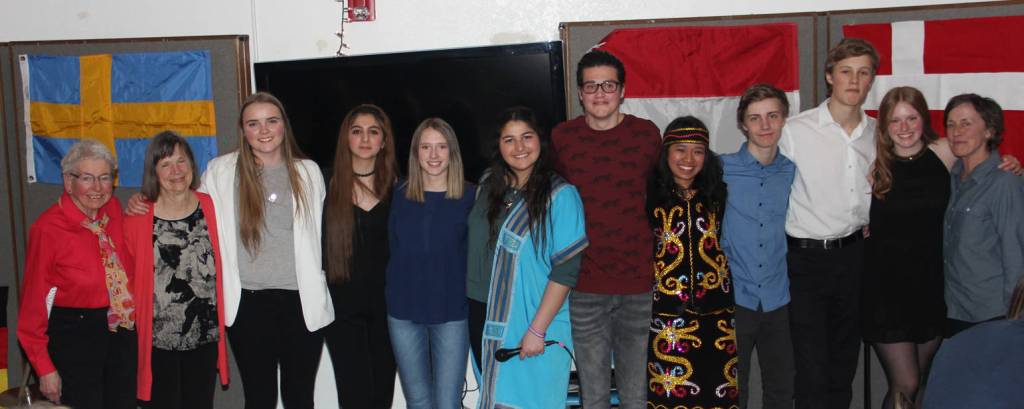 AFS students from nine countries gather for intercultural dinner.