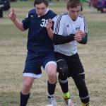 Soldotna&rsquo;s Eli Sheridan (left) and Nikiski&rsquo;s Sam Tauriainen battle for the ball April 30, 2016, at Nikiski High School. The Stars beat the Bulldogs 9-0. (Photo by Joey Klecka/Peninsula Clarion)