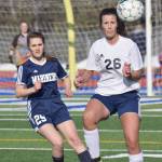 Homer&rsquo;s Mystique Ross and Soldotna&rsquo;s Whitney Wortham battle for the ball Tuesday, April 11, 2017, at Soldotna High School. (Photo by Jeff Helminiak/Peninsula Clarion)