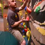 John Walker makes his way through a bouldering route on River City Wellness Center&rsquo;s new climbing wall on Saturday, April 8, 2017 in Soldotna, Alaska.