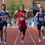 Kenai Central junior Josh Jackman (376) makes a run to the line between two competing 100-meter sprinters in May 2016 at the state track and field championships at Dimond Alumni Field in Anchorage. (Photo by Joey Klecka/Peninsula Clarion)