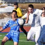 Soldotna junior Eli Sheridan (31) fights for the ball in the Palmer goalie box against Palmer&rsquo;s Isaiah Montoya, Friday afternoon at Justin Maile Field in Soldotna. (Photo by Joey Klecka/Peninsula Clarion)