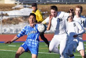 Soldotna junior Eli Sheridan (31) fights for the ball in the Palmer goalie box against Palmer&rsquo;s Isaiah Montoya, Friday afternoon at Justin Maile Field in Soldotna. (Photo by Joey Klecka/Peninsula Clarion)