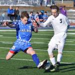 Soldotna junior Luke Trammell (5) fights for possession Friday afternoon against Palmer&rsquo;s Makeehan Knittle at Justin Maile Field in Soldotna. (Photo by Joey Klecka/Peninsula Clarion)