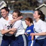 Soldotna&rsquo;s Abi Tuttle (left) congratulates freshman teammate Ryann Cannava on her second-half goal against Palmer, Friday afternoon at Justin Maile Field in Soldotna. (Photo by Joey Klecka/Peninsula Clarion)