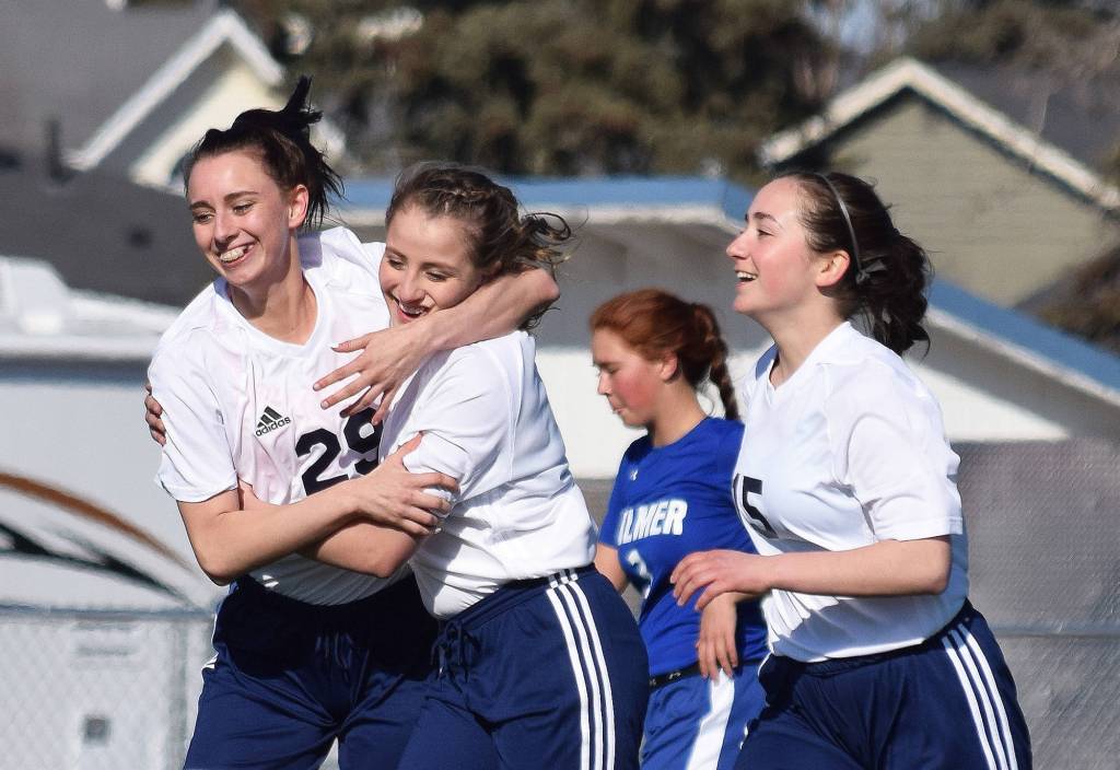 Soldotna&rsquo;s Abi Tuttle (left) congratulates freshman teammate Ryann Cannava on her second-half goal against Palmer, Friday afternoon at Justin Maile Field in Soldotna. (Photo by Joey Klecka/Peninsula Clarion)