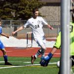 Kenai Central&rsquo;s Luke Beiser (24) prepares for a shot against Palmer goalie Caden Brown and defender Alex Coyne in Saturday&rsquo;s contest at Ed Hollier Field in Kenai. (Photo by Joey Klecka/Peninsula Clarion)