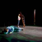 Derek Brown, in the role of Adam, sleeps while Anya Hondel and Elliot Fuhrman act out a scene between Eve and the snake during a production of &ldquo;The Diary of Adam and Eve,&rdquo; at the annual one-act play festival held at Soldotna High School. (Kat Sorensen/Peninsula Clarion)