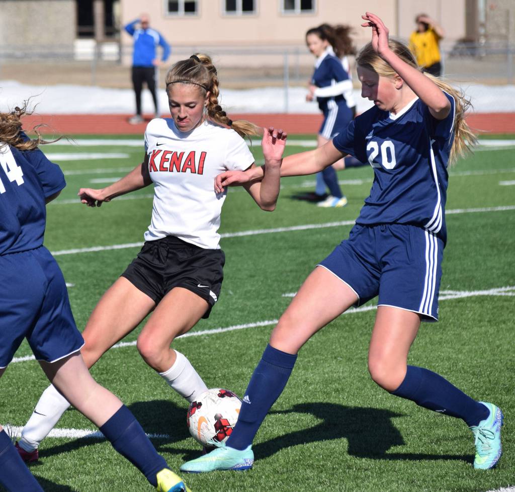 Kenai Central&rsquo;s Samantha Morse tries to take the ball away from Soldotna&rsquo;s Cameron Blackwell (20) Tuesday at Ed Hollier Field in Kenai. (Photo by Joey Klecka/Peninsula Clarion)