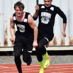 Nikiski&rsquo;s Jack Sullenger hands off to teammate Patrick Perry in the boys 400-meter relay in Saturday&rsquo;s Kenai Invitational at Ed Hollier Field in Kenai. (Photo by Joey Klecka/Peninsula Clarion)