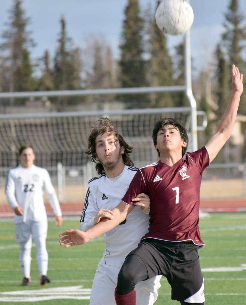 Kenai Central&rsquo;s Tomas Levy-Canedo and Ketchikan&rsquo;s Mark Jasper battle for the ball Wednesday, April 26, 2017, at Kenai Central High School. (Photo by Jeff Helminiak/Peninsula Clarion)