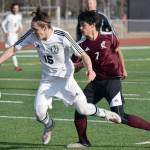 Kenai Central&rsquo;s Titus Riddall is fouled by Ketchikan&rsquo;s Mark Jasper on Wednesday, April 26, 2017, at Kenai Central High School. (Photo by Jeff Helminiak/Peninsula Clarion)