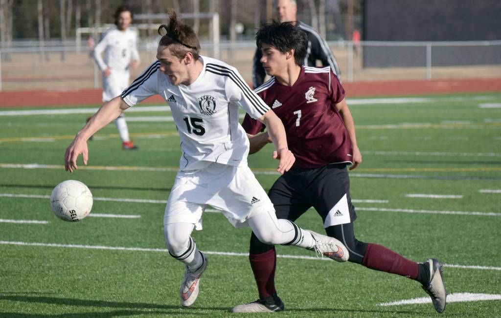 Kenai Central&rsquo;s Titus Riddall is fouled by Ketchikan&rsquo;s Mark Jasper on Wednesday, April 26, 2017, at Kenai Central High School. (Photo by Jeff Helminiak/Peninsula Clarion)