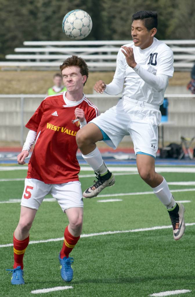 West Valley&rsquo;s Sean Cadigan and Soldotna&rsquo;s Alex Montague challenge for the ball Friday, April 28, 2017, at Soldotna High School. (Photo by Jeff Helminiak/Peninsula Clarion)