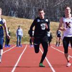 Nikiski junior Isaac Averill races to a victory in the boys 100-meter sprint alongside Teddy Croft of Homer (left) and Josh Jackman of Kenai Central (right) Saturday at the Homer Invite at Homer High School. (Photo by Joey Klecka/Peninsula Clarion)