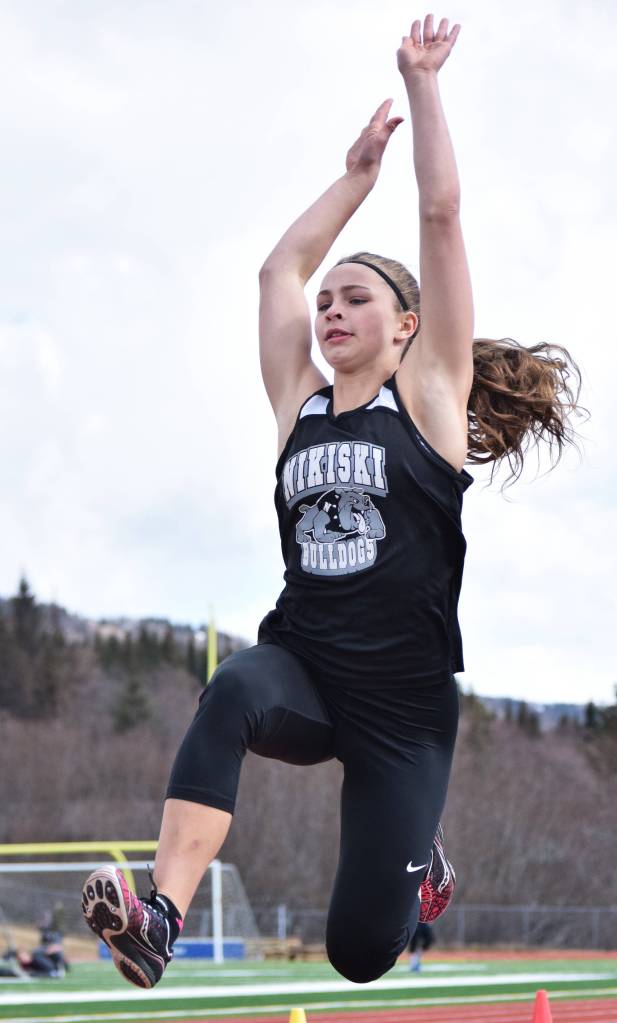 Nikiski freshman Kaitlyn Johnson makes a long jump attempt Saturday at the Homer Invite at Homer High School. (Photo by Joey Klecka/Peninsula Clarion)
