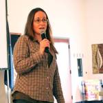 KDLL General Manager Jenny Neyman speaks to a crowd of people about the five days she spent stuck up on the Harding Icefield last year with fellow Soldotna resident Chris Hanna during a presentation Friday, April 28, 2017 at the Kenai Chamber of Commerce and Visitor Center in Kenai, Alaska. The evening was part of “Adventure Talks,” a KDLL series that will include on-air interviews with Kenai Peninsula residents about their adventures, as well as public presentations the last Friday of the month at the visitor center. (Megan Pacer/Peninsula Clarion)