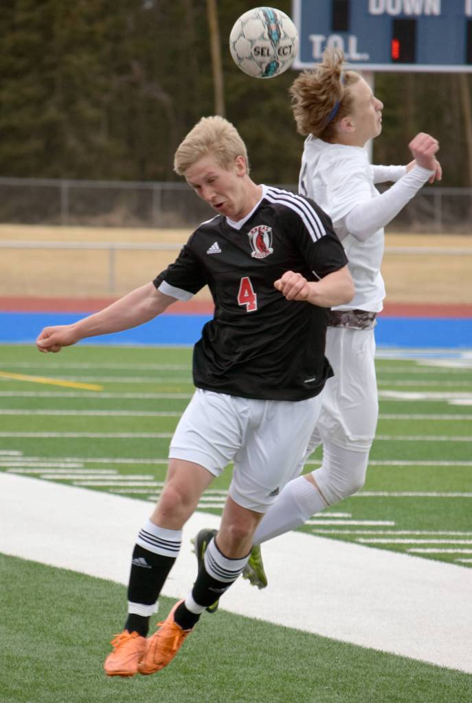 Kenai Central&rsquo;s Karl Danielson and Soldotna&rsquo;s Luke Trammell mix it up Tuesday, May 2, 2017, at Soldotna High School. (Photo by Jeff Helminiak/Peninsula Clarion)