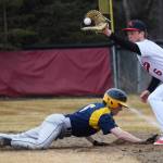 Kenai Central first baseman Zack Selinger grabs a throw from pitcher Gavin Pettersen to tag Homer baserunner Landon Bunting Tuesday evening at the Kenai Little League Fields. (Photo by Joey Klecka/Peninsula Clarion)