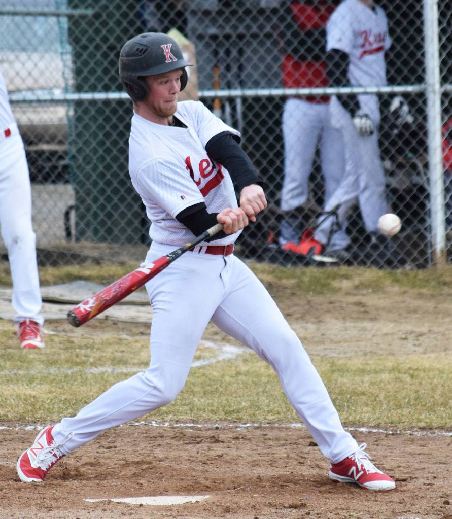 Kenai Central batter Zack Selinger swings at a pitch from Homer&rsquo;s Joe Ravin Tuesday evening at the Kenai Little League Fields. (Photo by Joey Klecka/Peninsula Clarion)