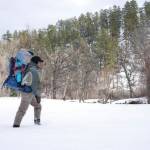 In this January photo, Josh Peterson carries his daughter, Miriam, to fish at Sand Creek in northeast Wyoming. (Christene Peterson /The Casper Star-Tribune via AP)