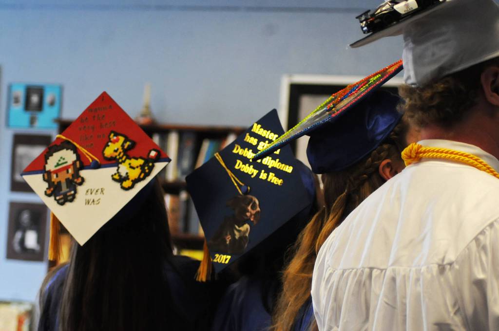 Four of the seven Cook Inlet Academy graduates of 2017 display the creative decorations on their caps before the school&rsquo;s graduation ceremony Sunday, May 7, 2017 in Soldotna, Alaska. (Elizabeth Earl/Peninsula Clarion)  Four of the seven Cook Inlet Academy graduates of 2017 display the creative decorations on their caps before the school&rsquo;s graduation ceremony Sunday in Soldotna. (Elizabeth Earl/Peninsula Clarion)