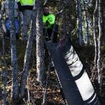 Alaska Department of Fish and Game staff arrange a chute to pour dirt down during streambank restoration work as part of a workshop at the Donald E. Gilman River Center on Wednesday, May 10, 2017 in Soldotna, Alaska. The free two-day annual workshop, hosted by Fish and Game, teaches people how to properly restore damaged fish habitat along streams in Alaska. (Elizabeth Earl/Peninsula Clarion)  Alaska Department of Fish and Game staff arrange a chute to pour dirt down during streambank restoration work as part of a workshop at the Donald E. Gilman River Center on Wednesday in Soldotna. The free two-day annual workshop, hosted by Fish and Game, teaches people how to properly restore damaged fish habitat along streams in Alaska. (Elizabeth Earl/Peninsula Clarion)