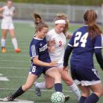 Homer freshman Eve Brau (6) works against Wasilla senior Ally Hull (3) for possession during Wasilla&rsquo;s 4-1 win over the Mariners in the Northern Lights Conference quarterfinals Thursday, May 18, 2017, at Colony High School. (Photo by Jeremiah Bartz/Frontiersman.com)