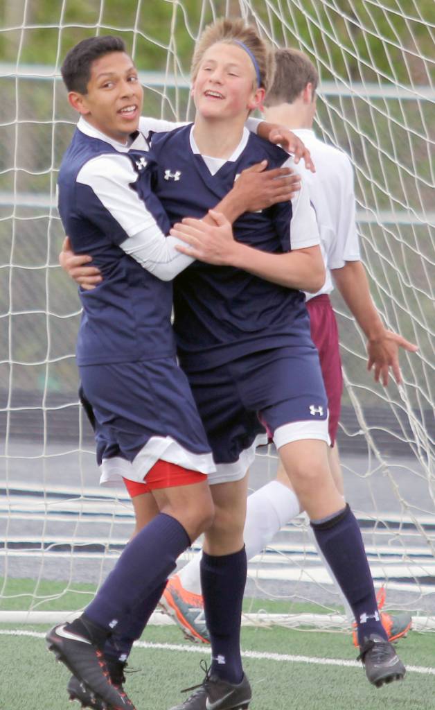Soldotna&rsquo;s Alex Montague and Brayden VanMeter celebrate a goal during the Northern Lights Conference Championships quarterfinals Thursday, May 18, 2017, at Colony High. (Photo by Jeremiah Bartz/Frontiersman.com)