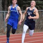 Cook Inlet Academy&rsquo;s Noah Leaf (left) races Soldotna&rsquo;s Brenner Furlong in the boys 200-meter sprint April 22 at the Kenai Invitational at Ed Hollier Field in Kenai. (Photo by Joey Klecka/Peninsula Clarion)