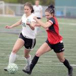 Colony&rsquo;s Sahara Iverson and Kenai&rsquo;s Cassi Holmes run to the ball during Colony&rsquo;s 1-0 win over the Kardinals during the Northern Lights Conference girls semifinals Friday, May 19, 2017, at Colony High. (Photo by Jeremiah Bartz/Frontiersman.com)