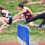Homer&rsquo;s Lauren Evarts (far left) leads the field over the first barrier in the Class 3A girls 100-meter hurdles final Saturday at the Region III track & field championships in Homer. (Photo by Joey Klecka/Peninsula Clarion)