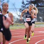 Soldotna&rsquo;s Brittany Taylor hands the baton off to teammate Tovia Bremond-Hilton in the Class 4A girls 800-meter relay Saturday at the Region III track & field championships in Homer. (Photo by Joey Klecka/Peninsula Clarion)