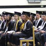 Soon-to-be graduates of Nikiski Middle-High School watch in rapture as their classmate, Mark Weathers, performs &ldquo;Divenire&rdquo; on the piano during their ceremony Tuesday, May 23, 2017 at the school in Nikiski, Alaska. (Megan Pacer/Peninsula Clarion)
