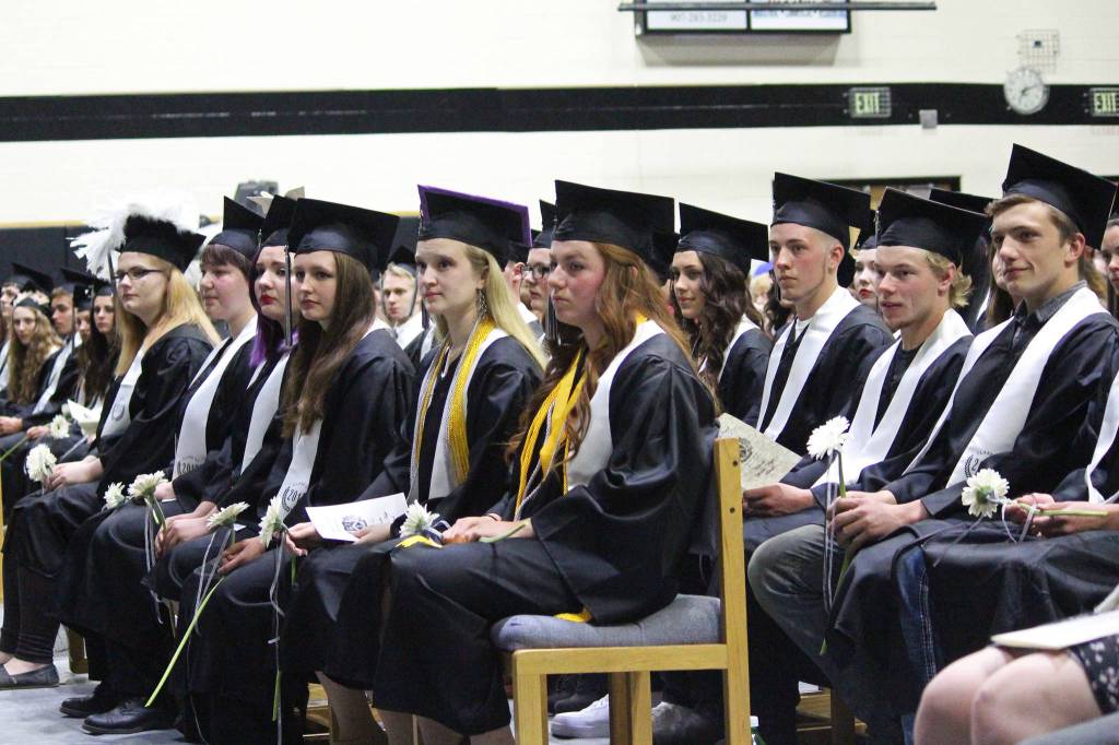 Soon-to-be graduates of Nikiski Middle-High School watch in rapture as their classmate, Mark Weathers, performs &ldquo;Divenire&rdquo; on the piano during their ceremony Tuesday, May 23, 2017 at the school in Nikiski, Alaska. (Megan Pacer/Peninsula Clarion)