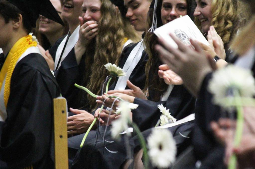 Soon-to-be graduates of Nikiski Middle-High School laugh and cheer during their ceremony Tuesday, May 23, 2017 at the school&rsquo;s gymnasium in Nikiski, Alaska. (Megan Pacer/Peninsula Clarion)