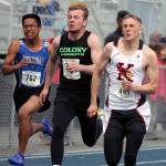 Kenai Central&rsquo;s Josh Jackman, right, stays just ahead of Colony&rsquo;s Jon Pomrenke during the boys&rsquo; 100 meters preliminaries on the first day of the ASAA/First National Bank State Track and Field Championships Friday at Palmer High School. (Photo by Jeremiah Bartz/Frontiersman.com)