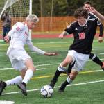 West Valley&rsquo;s Vaughn Simpson (left) battles for possession against Kenai Central&rsquo;s Damien Redder in Friday&rsquo;s state tournament semifinal matchup at Service High School. (Photo by Joey Klecka/Peninsula Clarion)