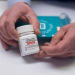 Tim Stifter, pharmacist for Juneau Drug, displays a generic form of Suboxone on Tuesday, May 23, 2017. The drug is used to stabilize brain chemistry in patients suffering from opioid dependency. (Michael Penn/Juneau Empire)