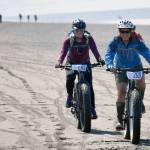 Morgan Aldridge and Mary Simondsen approach the end of the 10-mile bike ride at the Mouth to Mouth Wild Run and Ride on Monday, May 29, 2017. (Photo by Jeff Helminak/Peninsula Clarion)