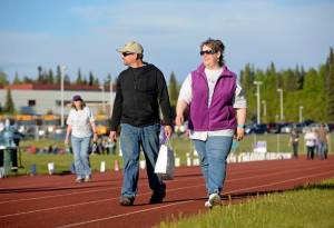 Walkers circle the track during the six-hour Relay for Life fundraiser event for the American Cancer Society on Friday, June 2, 2017 at Skyview Middle School near Soldotna, Alaska. Central peninsula Relay for Life organizer Johna Beech said that this year she began conducting various fundraising events for cancer research in January and will continue until November. (Ben Boettger/Peninsula Clarion)