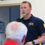 Cook Inlet Region Inc. Manager of Surface Estate Land and Resources Benjamin Mohr speaks to a crowd of Funny River residents Friday at the Funny River Community Center in Funny River. Residents gathered there to discuss the pros and cons of increasing public access to the Kenai River through a boat launch along Funny River Road. (Megan Pacer/Peninsula Clarion)